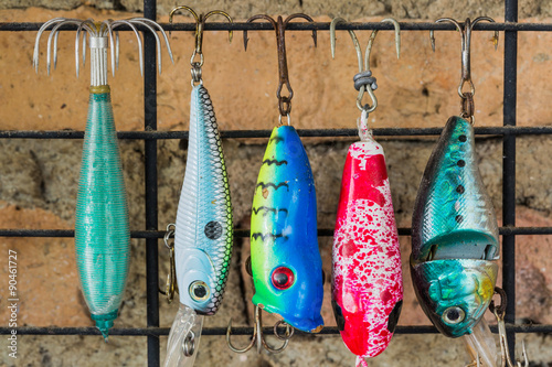 Old colorful fishing lure hanging on the wall
