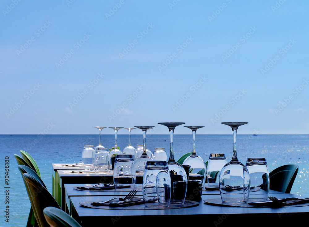 Fototapeta premium Served Restaurant Tables on Sea Coast