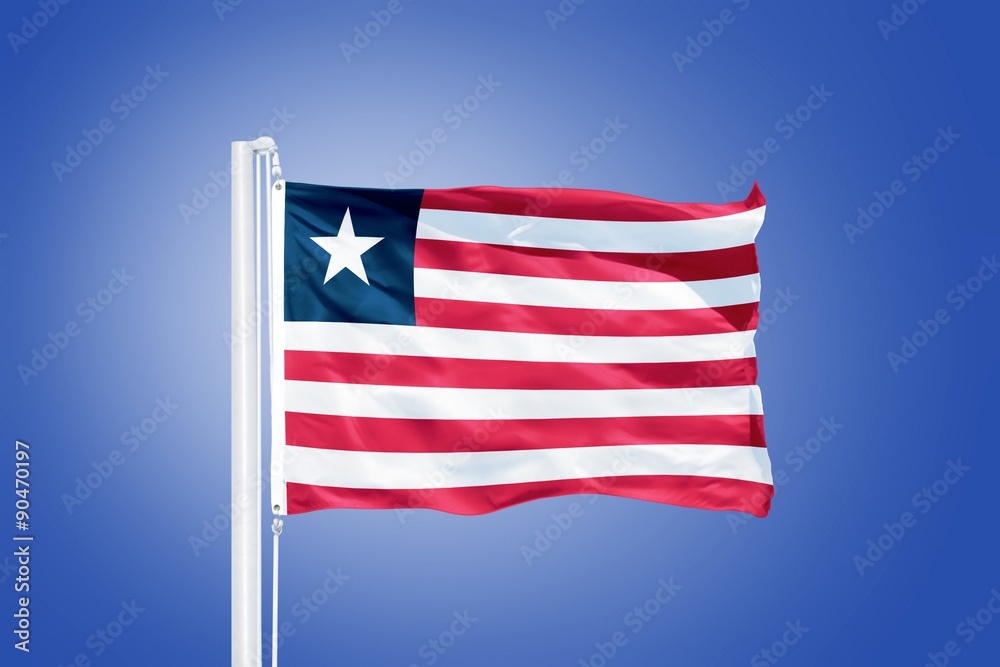 Flag of Liberia flying against a blue sky
