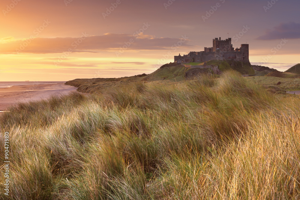 Sunrise over Bamburgh Castle, Northumberland, England.