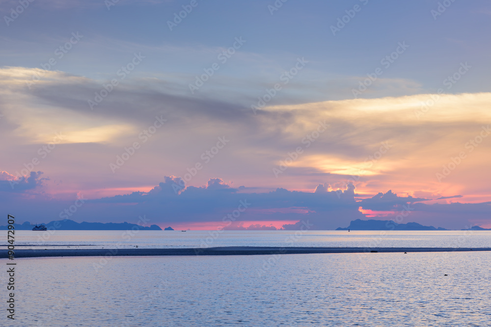 Panoramic dramatic sunset sky and tropical sea at dusk..