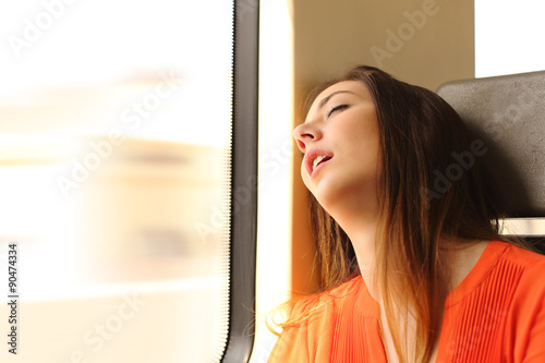 Traveler sleeping in a train travel