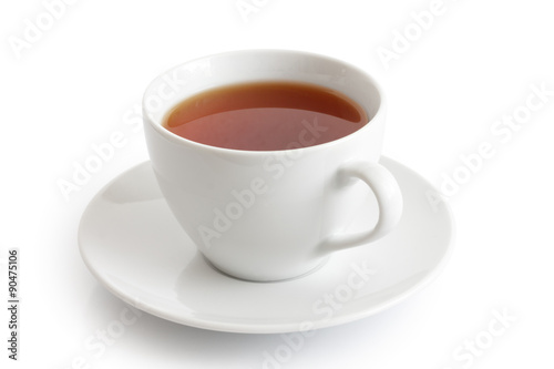 White ceramic cup and saucer with rooibos tea. Isolated.