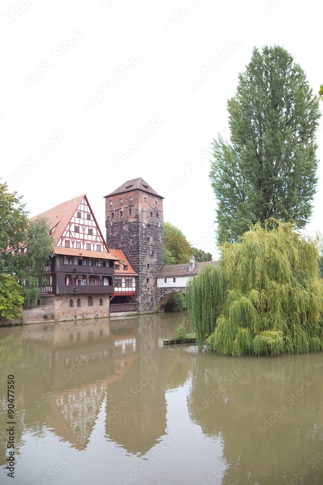 Half-timbered house and medieval tower in the Old Town of Nuremb