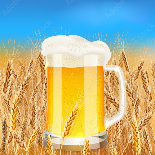 Light beer mug on sunny summer field
