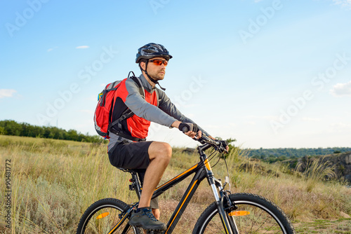 Cyclist Riding the Bike on the Beautiful Summer Mountain Trail. Sport Concept. © Maksym Protsenko