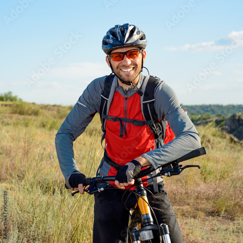 Portrait of Young Cyclist in Helmet and Glasses