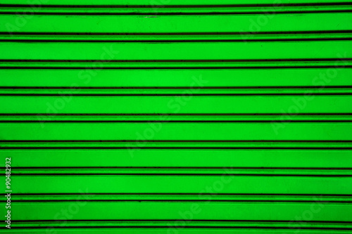 Green steel roller shutter door background ( garage door with ho