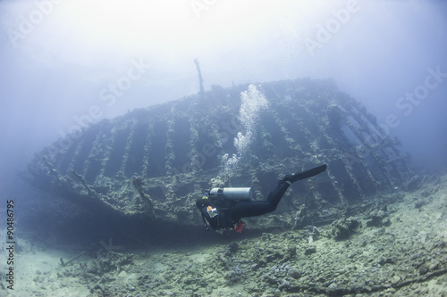 Diver exploring a large shipwreck photo