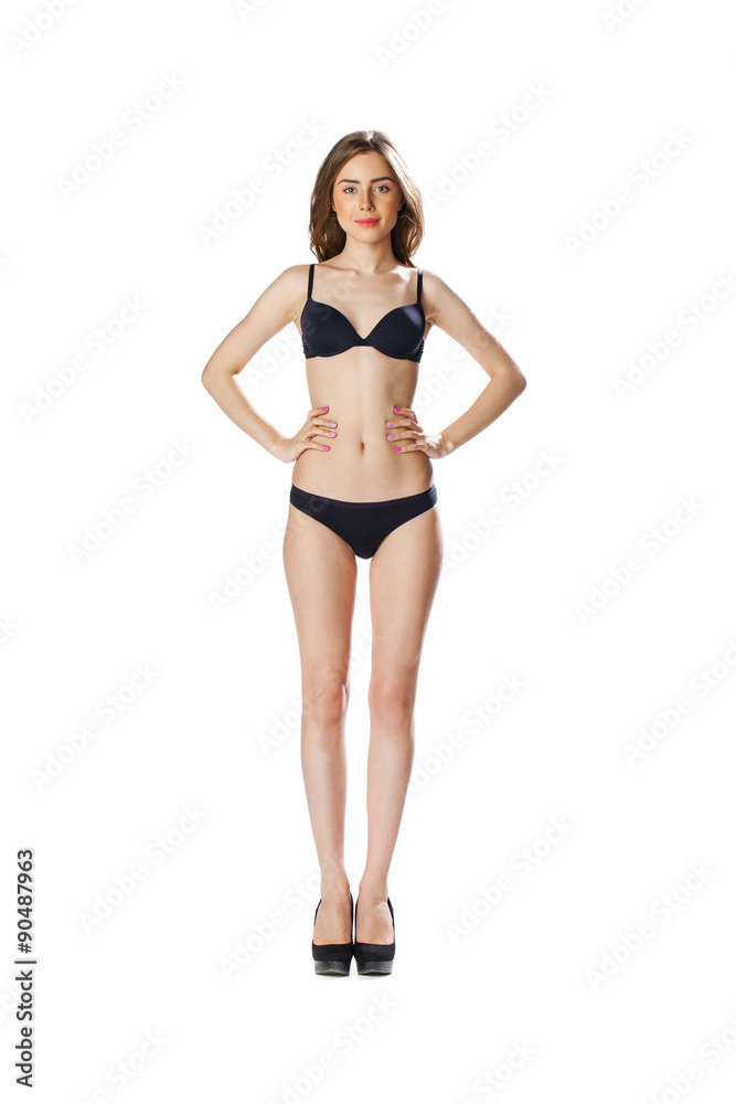 Full length portrait of a beautiful young model in black bikini