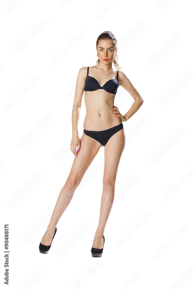 Full length portrait of a beautiful young model in black bikini Full length portrait of a beautiful young model in black bikini