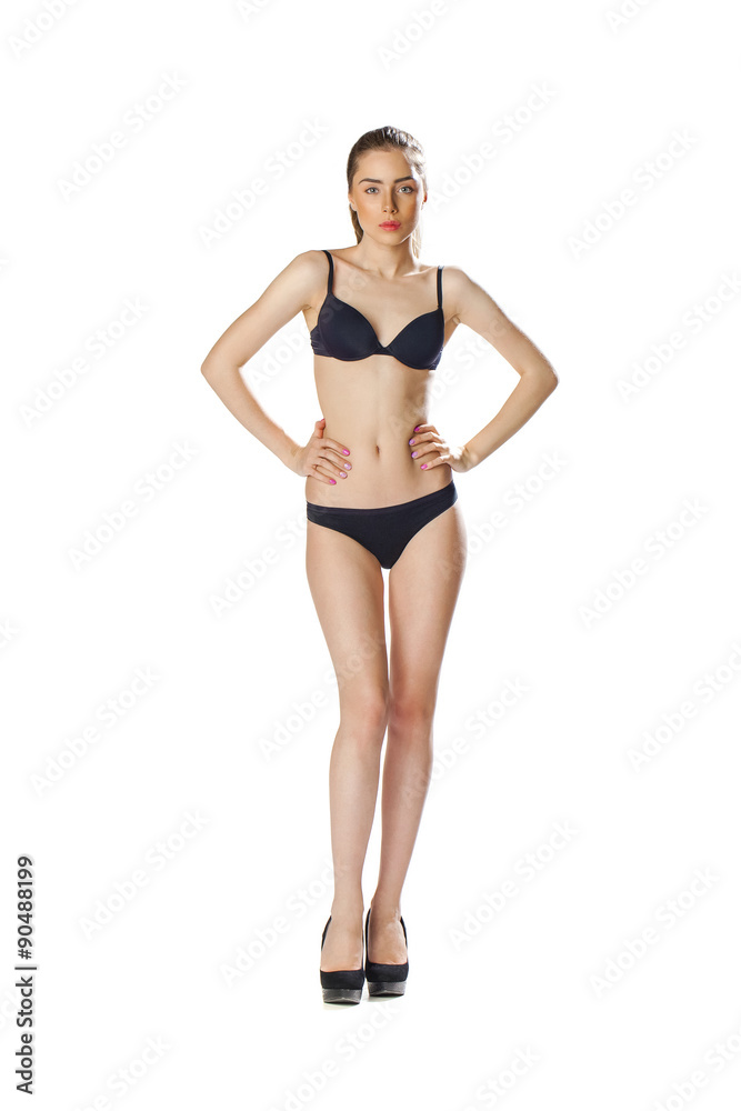 Full length portrait of a beautiful young model in black bikini