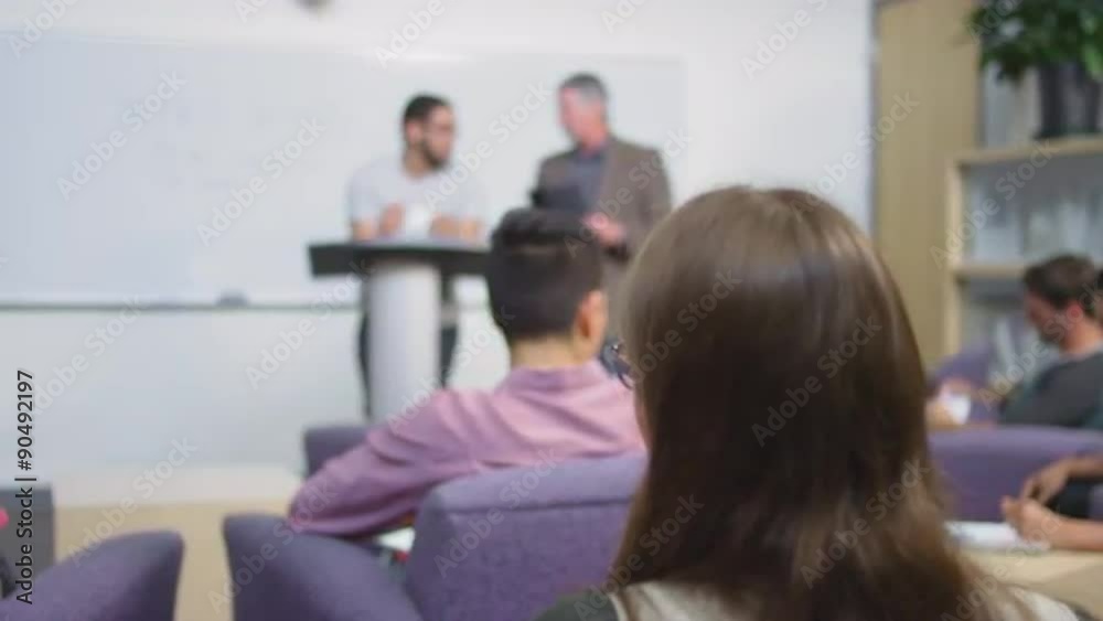 A professor helps his student give his speech
A professor helps his student give his speech