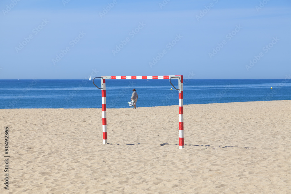 Handball goal on a beach with ocean in the background Handball goal on a beach with ocean in the background