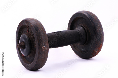 Old rusty dumbbell isolated on white background.