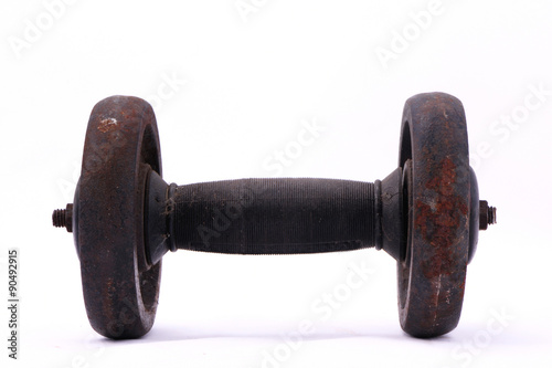 Old rusty dumbbell isolated on white background