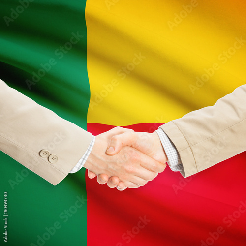 Businessmen handshake with flag on background - Benin