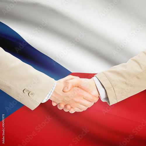 Businessmen handshake with flag on background - Czech Republic