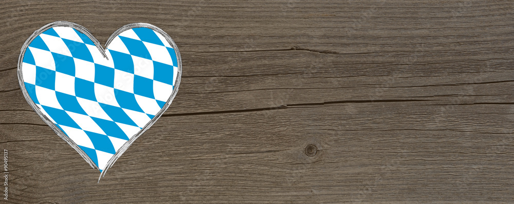 Obraz premium Oktoberfest - blau weisses Herz auf Holz