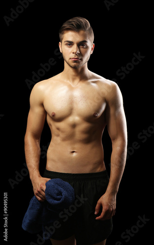 Muscle young man holding to...