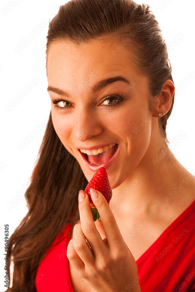 Beautiful happy asian caucasian woman in red t shirt eating stra Beautiful happy asian caucasian woman in red t shirt eating stra