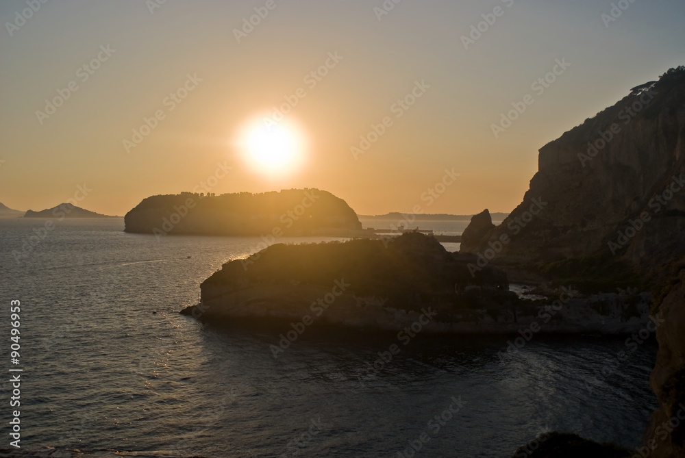 Sunset behind the island of Nisida in Naples, Italy