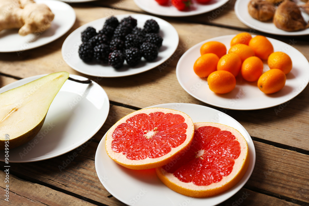 Different products on saucers on wooden table close up Different products on saucers on wooden table close up