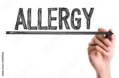 Hand with marker writing the word Allergy