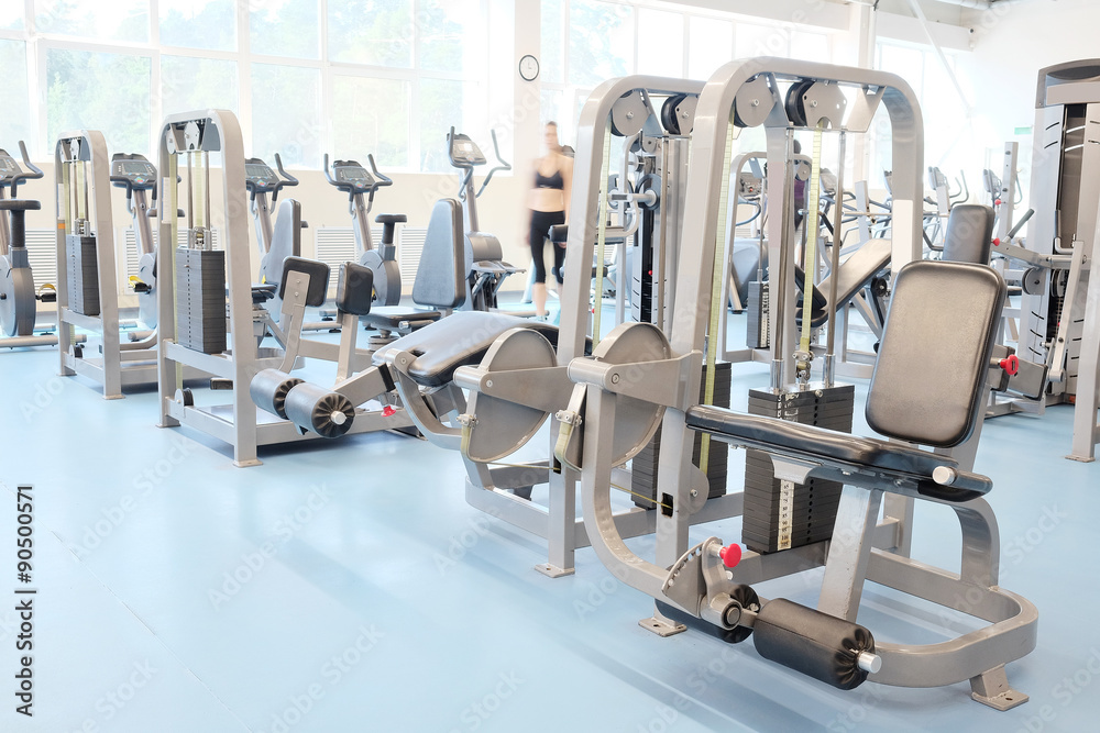 Fototapeta premium Interior of a fitness hall with fitness equipment