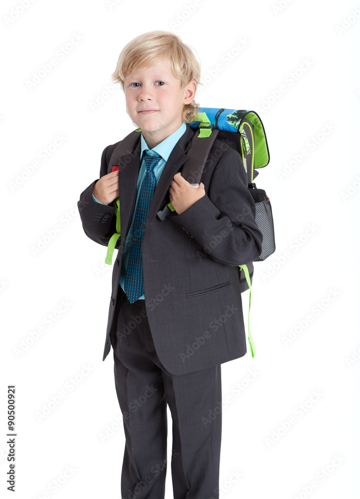 Seven years old schoolboy with schoolbag hanging on the back, isolated on white background Seven years old schoolboy with schoolbag hanging on the back, isolated on white background