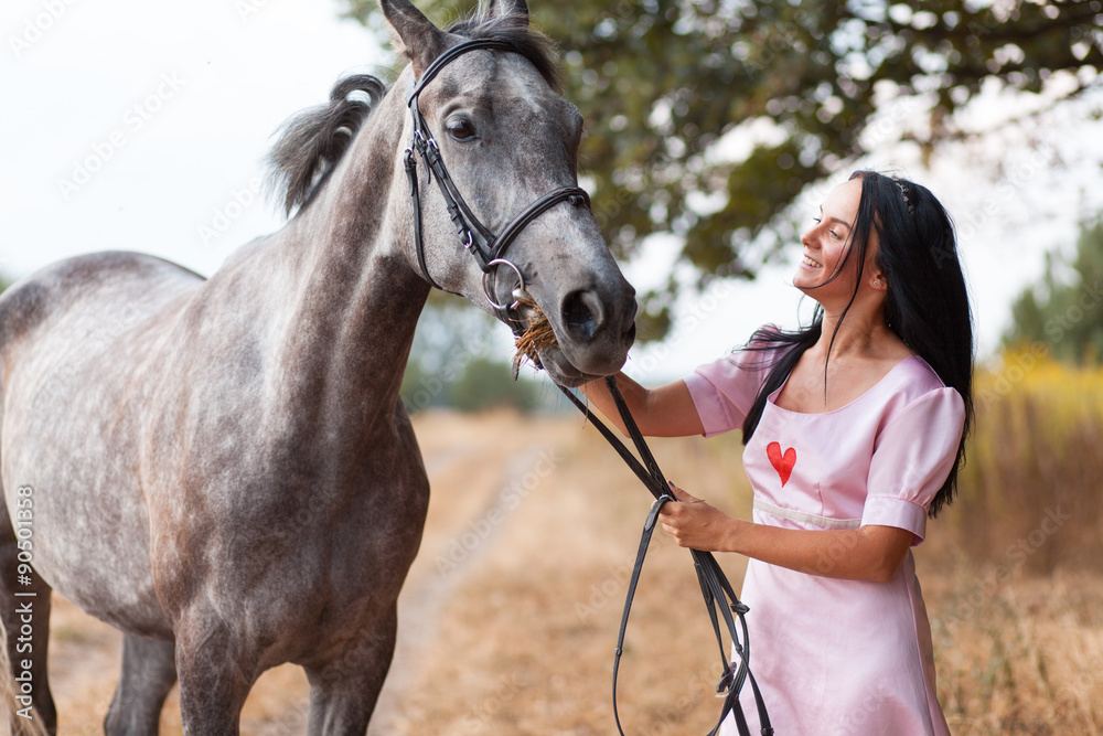 Fototapeta premium Young woman with a horse