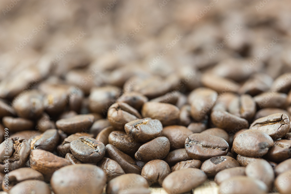 coffee beans in sack bag on wooden background coffee beans in sack bag on wooden background