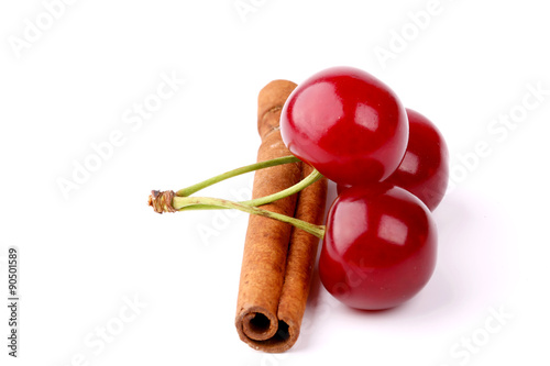 cherry and cinnamon isolated on white background