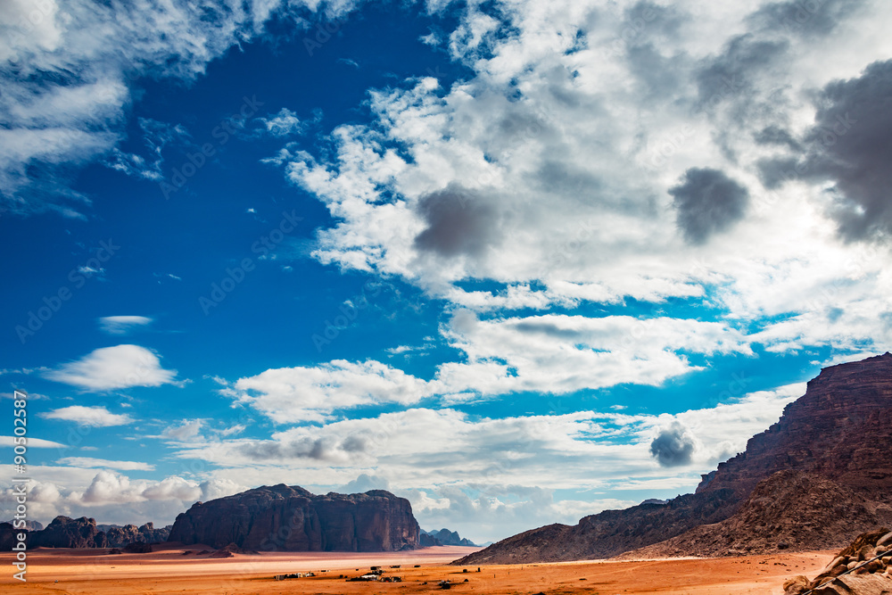 Wadi Rum in southern Jordan 60 km to the east of Aqaba. Wadi Rum has led to its designation as a UNESCO World Heritage Site and is known as The Valley of the Moon. Wadi Rum in southern Jordan 60 km to the east of Aqaba. Wadi Rum has led to its designation as a UNESCO World Heritage Site and is known as The Valley of the Moon.