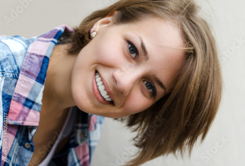 portrait of a smiling girl with tilted head