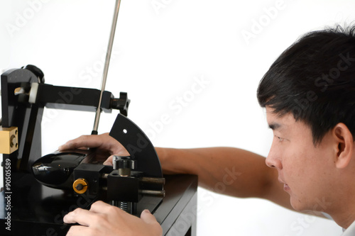 Club Maker checking the loft angle of golf club