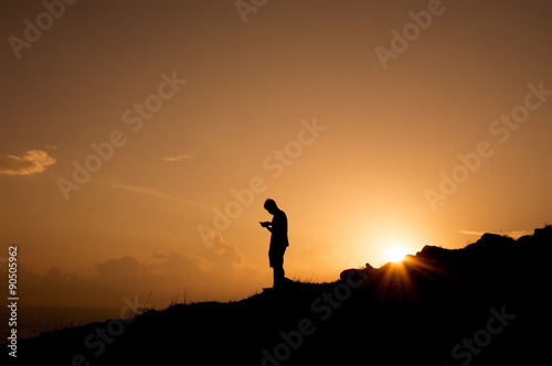 Silhouette of man at mountion photo
