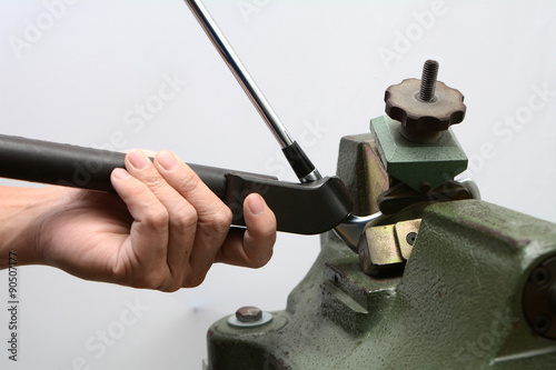 Club maker adjust loft and lie of golf club iron