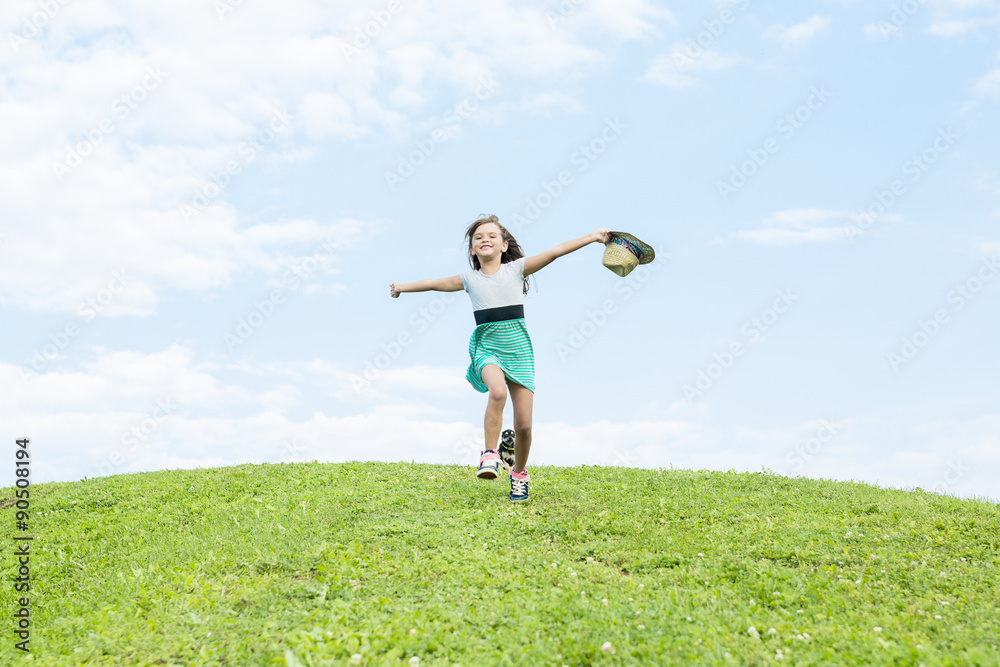 Beautiful portrait of a little girl outside on grass Beautiful portrait of a little girl outside on grass