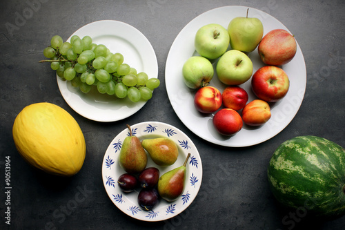 Fresh fruits on kitchen table background. Healthy eating concept.