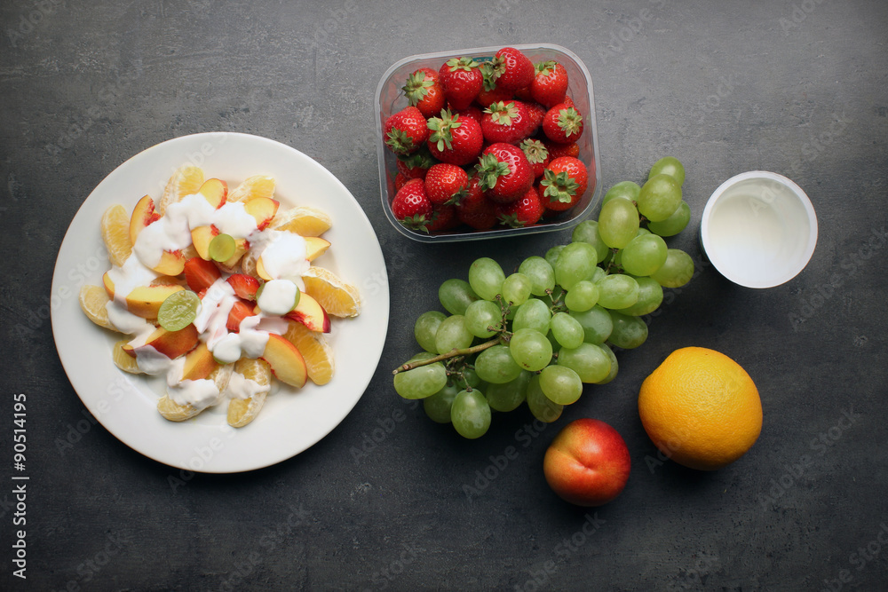 Fresh fruit snack with yoghurt on kitchen table - healthy eating background Fresh fruit snack with yoghurt on kitchen table - healthy eating background