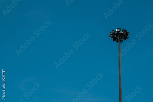 Spotlight tower with blue sky background