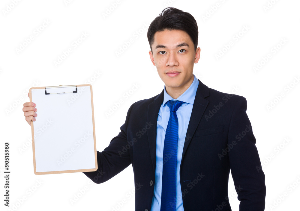 Asian businessman showing the clipboard with blank page Asian businessman showing the clipboard with blank page