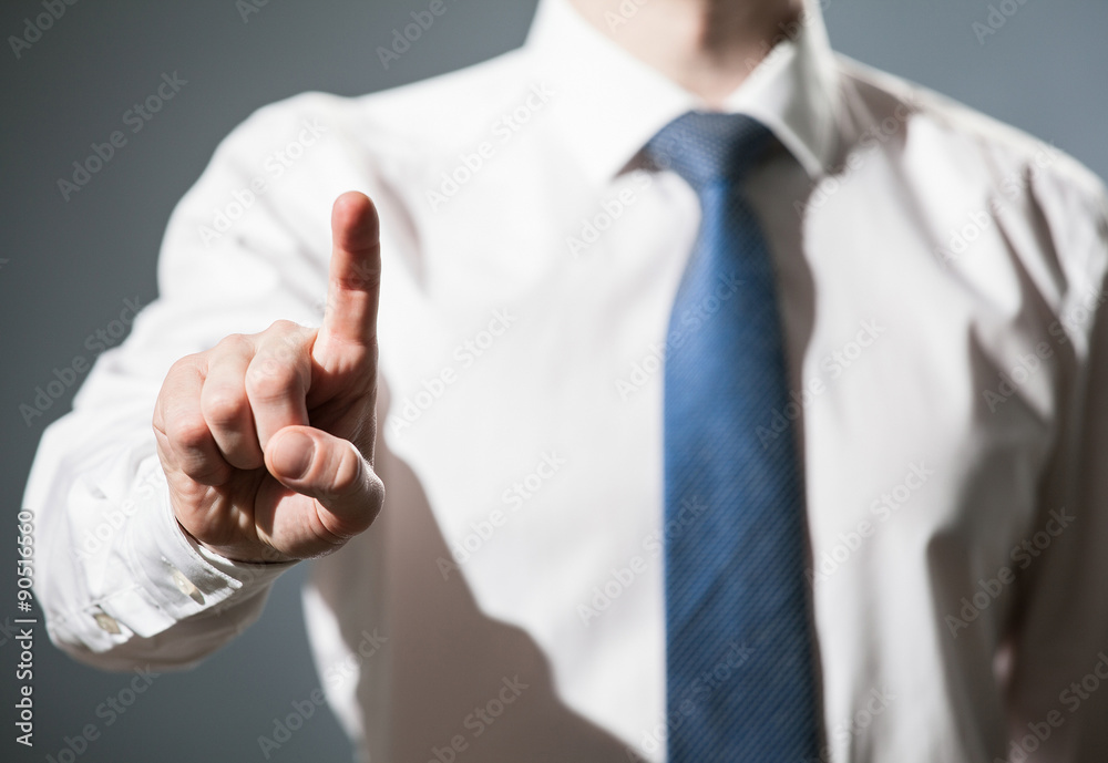 Businessman touching with index finger something Businessman touching with index finger something