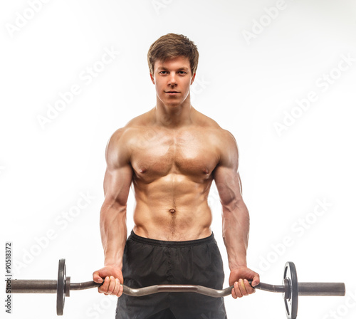 Muscular shirtless man with barbell.