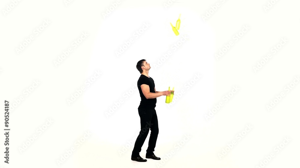 bartender does a trick with a shaker on white bartender does a trick with a shaker on white