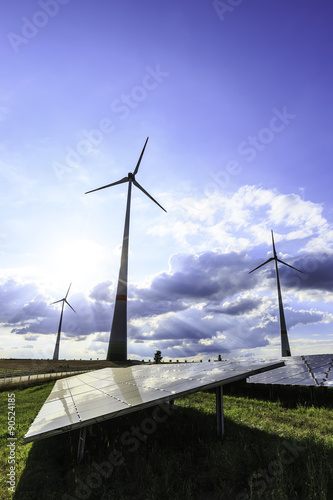 wind turbines and modern solar panels in the country side 