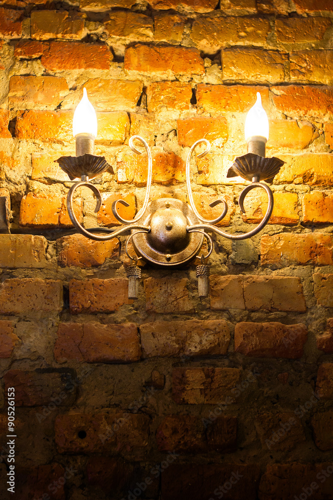 Fototapeta premium glowing lantern on the wall