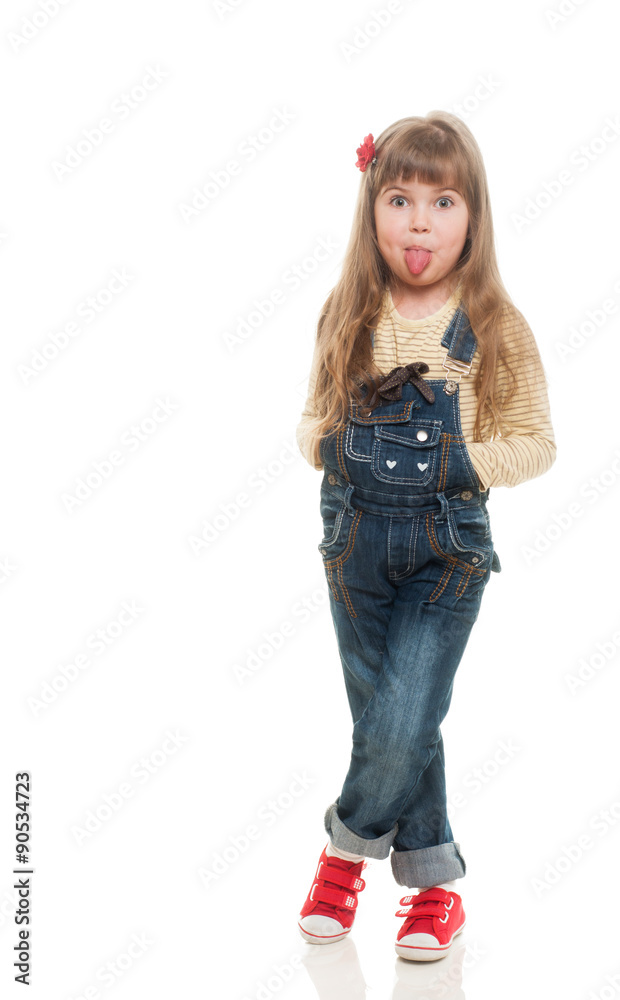 cute little girl wearing jeans overall posing in studio and stic cute little girl wearing jeans overall posing in studio and stic