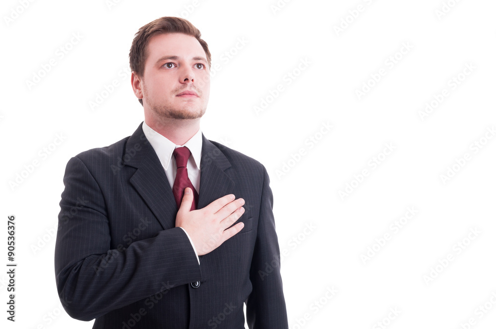 Proud businessman or lawyer holding one hand on heart Proud businessman or lawyer holding one hand on heart
